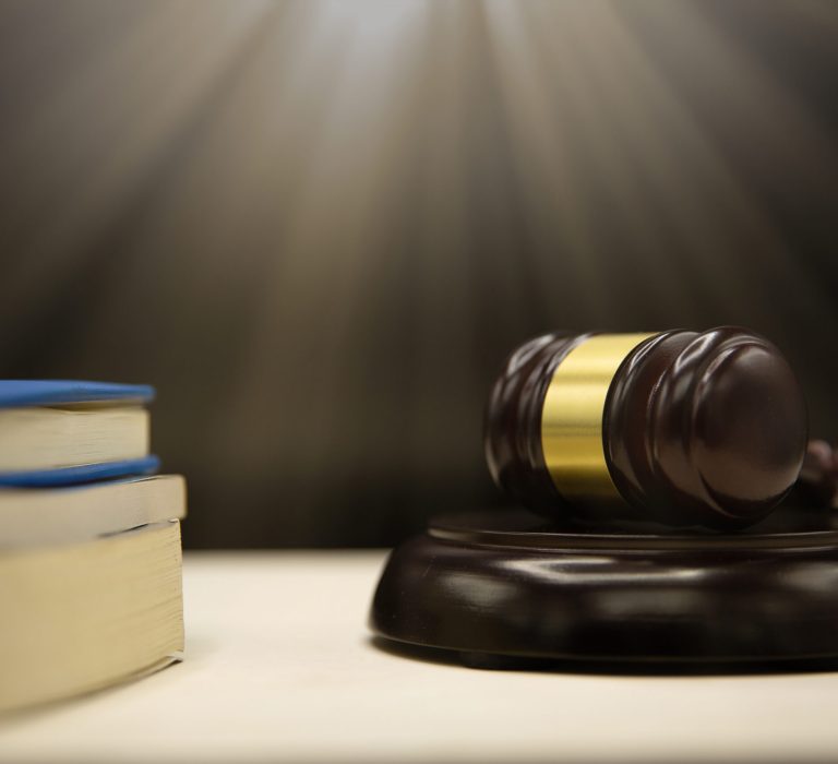 Judges gavel and book on wooden table. Law and justice concept background.